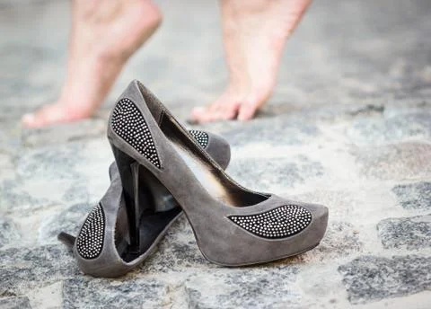 Shoes on pavement Stock Photos