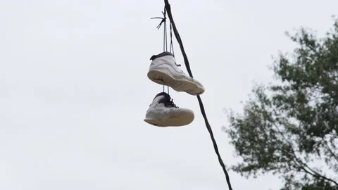 Shoes on a powerline Stock Footage 149379824