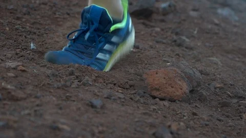 Shoes running in the dirt Stock Footage 107325730