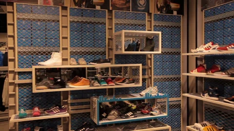 Shoes in stands in store pan Video stock 36411481