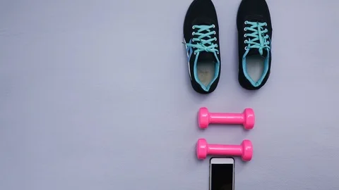 Shoes stop motion - close up of objects for exercise on gray background. Video stock 98120742