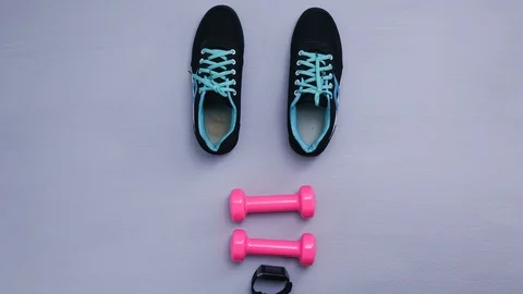 Shoes stop motion - close up of objects for exercise on gray background. Video stock 98120952