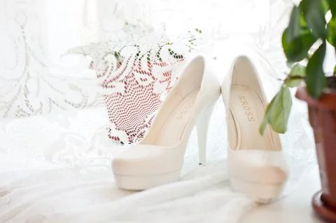 Shoes on a window sill. Stock Photos