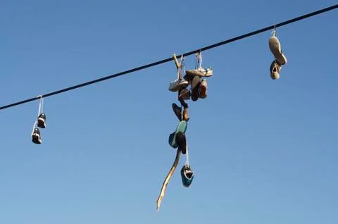 Shoes on a wire Fotos de archivo