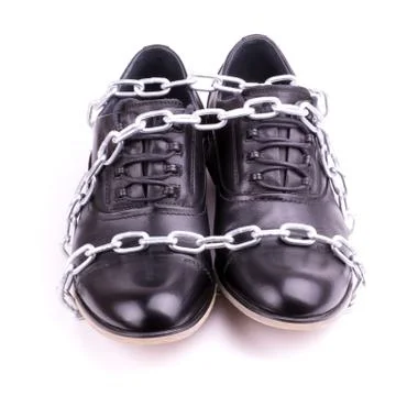 Shoes wrapped in chains Stock Photos