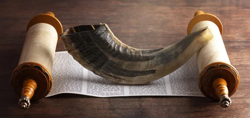 A Shofar Rams Horn and a Tora Scroll on a Wooden Table Stock Photos