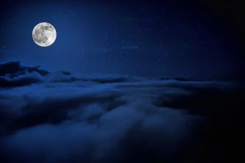 Shone circle of the moon in darkness on a background of the star sky and clou Foto stock