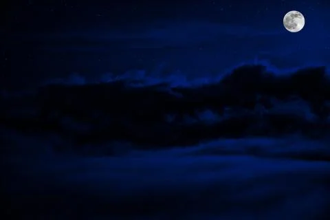 Shone circle of the moon in darkness on a background of the star sky and clou Foto stock