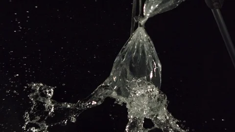 Shoot a bag of water in slow motion 1.000 fps Stock Footage