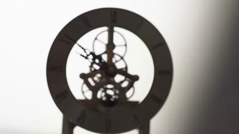 Shoot the clock in Backlight ,time passes as the clock gears turn. Stock Footage 162653290