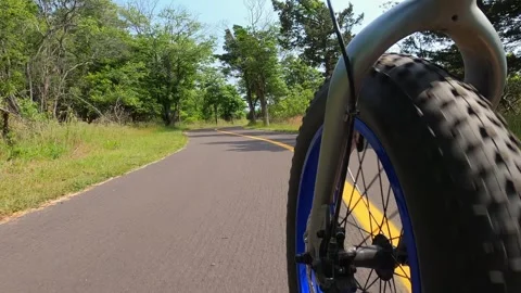 Shoot of the front wheel of an electric bicycle at speed Stock Footage 300060653