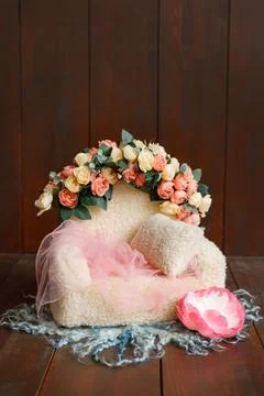 Shoot set up with sofa and a lot of flowers on the wood background. Stock Photos