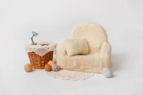 Shoot set up with sofa, table and balls of thread Stock Photos