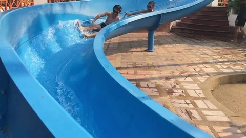 Shoot from smartphone, Slow motion of young Asian Thai boy play in the slider. 스톡 동영상 73561006