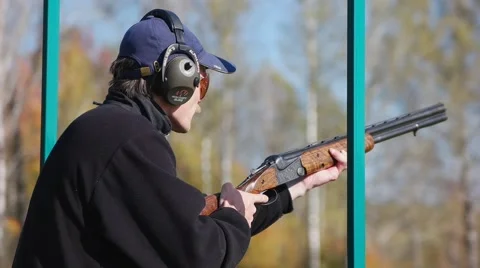 Shooter changes holder after shot. Smoking barrel. Slow motion. Stock-Footage 68492326