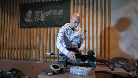 Shooter loading cartridges in magazines. Preparing for a training shooting. 動画素材 113293839