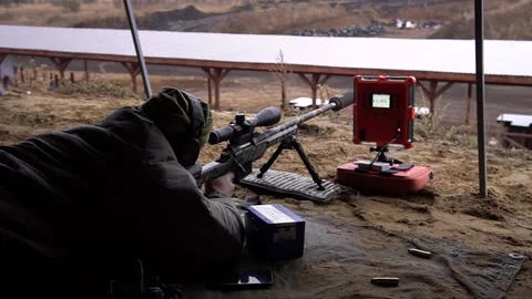 The shooter makes a test shot, checking the speed of the bullet Video stock 229548450