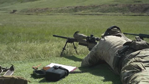 Shooter performs the exercise competitions in high-precision shooting Stock Footage 243797915