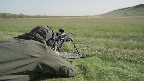 Shooter performs the exercise competitions in high-precision shooting Stock Footage 243797999