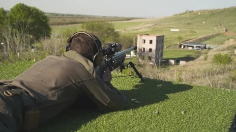 Shooter performs the exercise competitions in high-precision shooting Stock Footage 243798279
