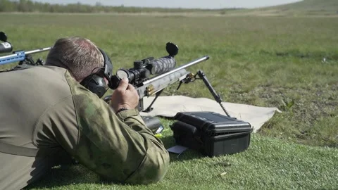 Shooter performs the exercise competitions in high-precision shooting Stock Footage 243798471