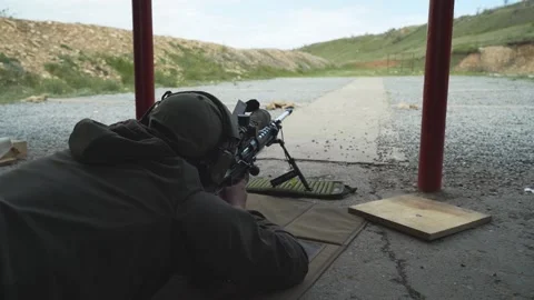 Shooter performs the exercise competitions in high-precision shooting Stock Footage 243798491