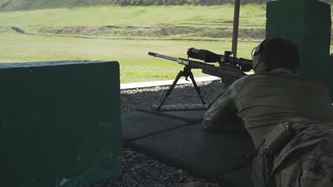 Shooter performs the exercise competitions in high-precision shooting Stock Footage 243798597