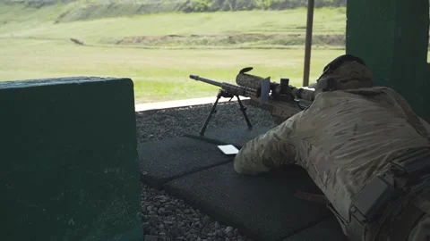Shooter performs the exercise competitions in high-precision shooting Stock Footage 243798680