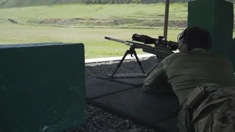 Shooter performs the exercise competitions in high-precision shooting Stock Footage 243908991