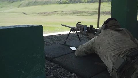 Shooter performs the exercise competitions in high-precision shooting Stock Footage 243909053