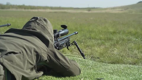 Shooter performs the exercise competitions in high-precision shooting Stock Footage 243909122