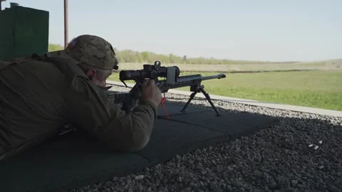 Shooter performs the exercise competitions in high-precision shooting Stock Footage 243909140