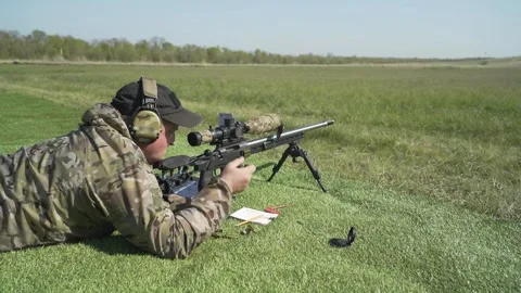 Shooter performs the exercise competitions in high-precision shooting Stock Footage 243909158