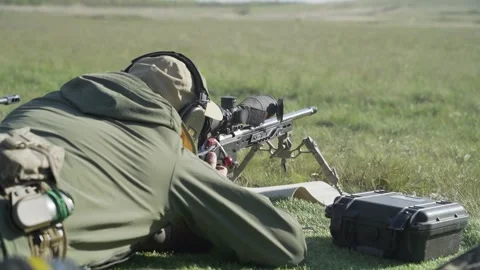 The shooter performs an exercise on targets with a sniper rifle Vídeos de archivo 243486307
