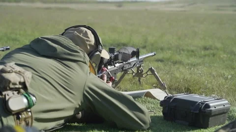 The shooter performs an exercise on targets with a sniper rifle Stock Footage 243908732