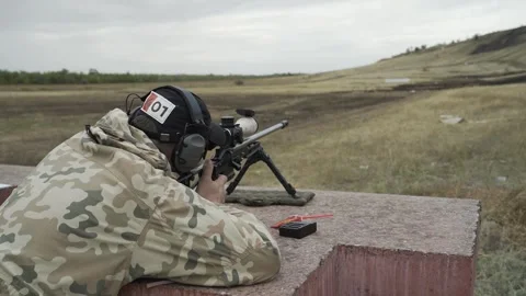 The shooter performs exercises on targets in a sitting position Stock-Footage 250342263