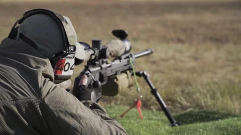 The shooter prepares to shoot in a prone position and makes a shot Stock Footage 250342313