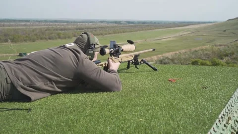 A shooter shoots at a target in a high-precision shooting competition Stock Footage 243798518