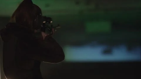 Shooter Silhouette Aiming Rifle Down the Lane, Indoor Range, Wide Shot Stock Footage 341322802