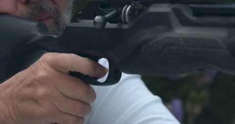The Shooter Takes Aim and Pulls the Trigger. Stock Footage