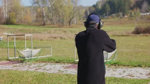 Shooter training to hit target. Close. Slow motion. 120 fps. Stock-Footage 68491482