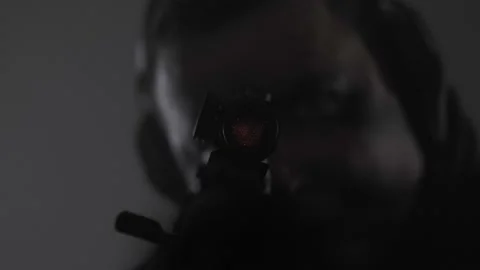 The shooter's face. Collimator. Concentration. Glasses. Headphones. Stock Footage 230109262