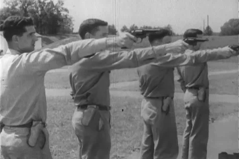 Shooters Lined Up with revolver during target training - 1960 Stock Footage 106067976