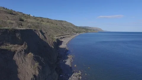Shooting from the air of  of long empty beach in the village Morskoe, Crimea Stock Footage 114052440