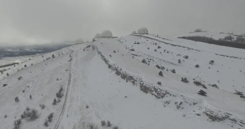 Shooting from the air of radar stations on top of mountain Ai-Petri, Crimea Stock Footage 113139640