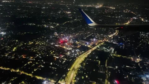 Shooting from the airplane window at night view of the city Stock Footage 234052301