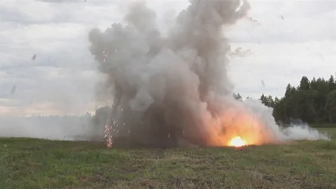Shooting and explosions. An armed man gets under mortar fire. Stock Footage 76963771