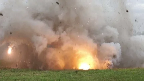 Shooting and explosions. An armed man gets under mortar fire. War Stock Footage 76963805