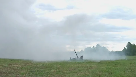 Shooting and explosions. An armed man gets under mortar fire. War Stock Footage 77330564