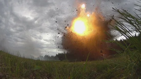 Shooting and explosions. War. An armed man gets under mortar fire. Slow motion Stock Footage